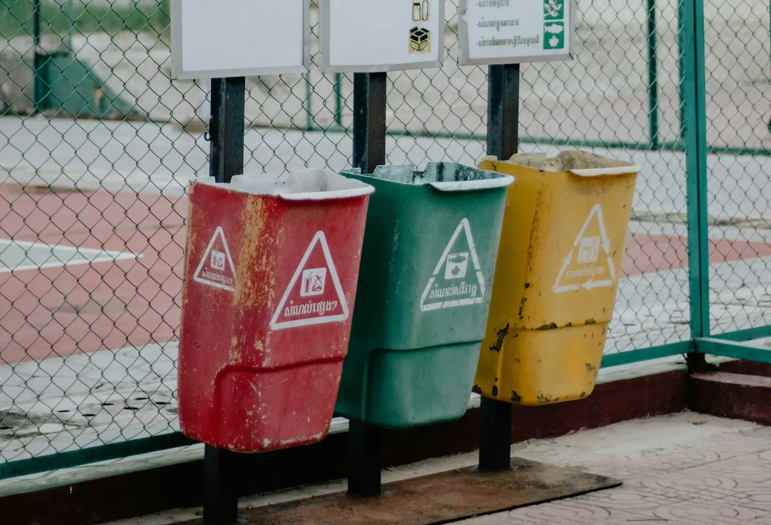red and white trash bins